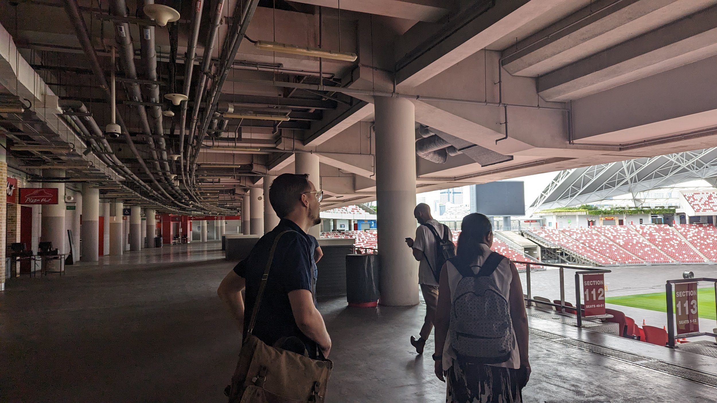 On-site venue walkthrough — observing the stadium concourse and wayfinding environment